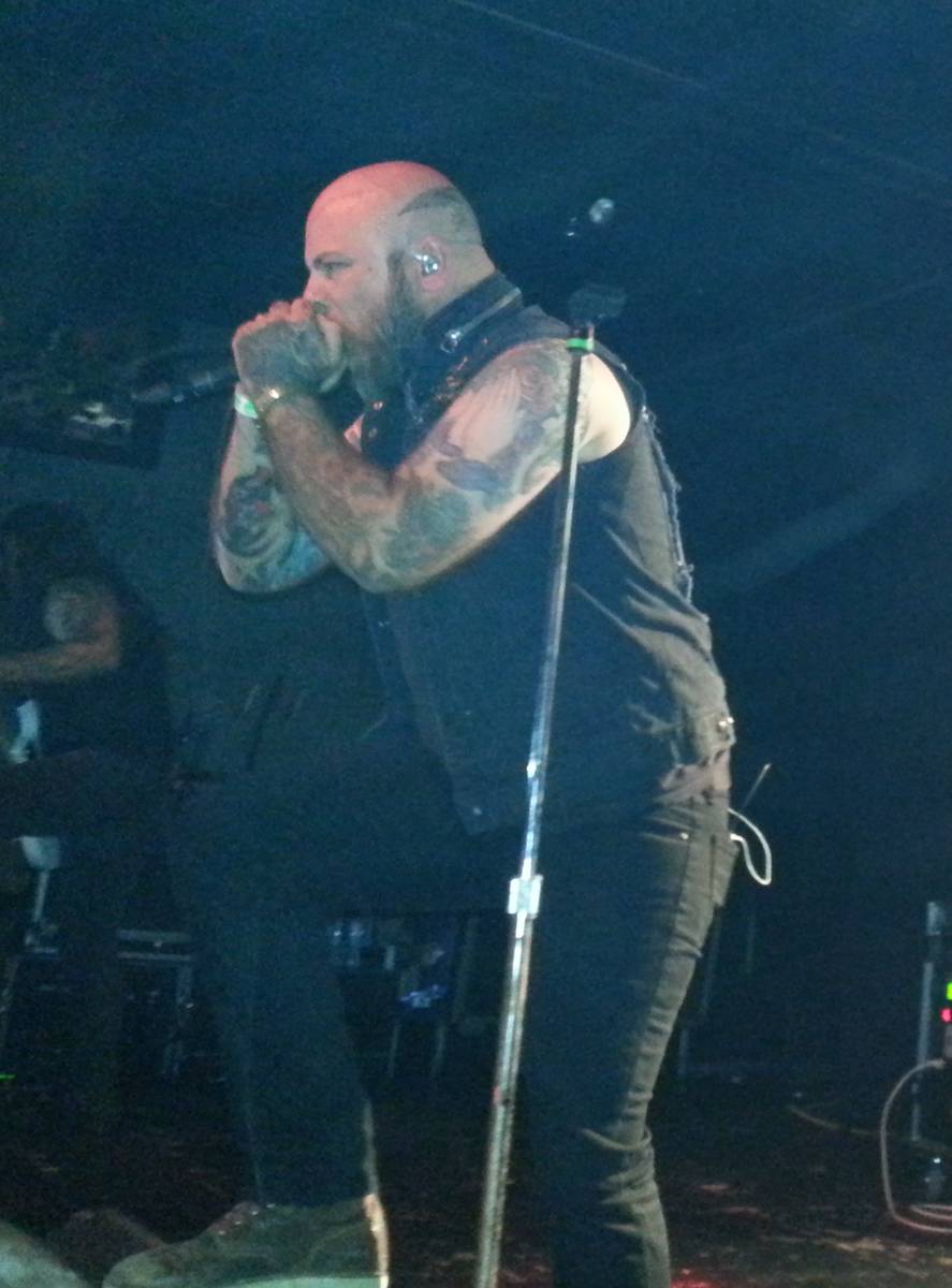 Demon Hunter singer Ryan Clark singing into a microphone