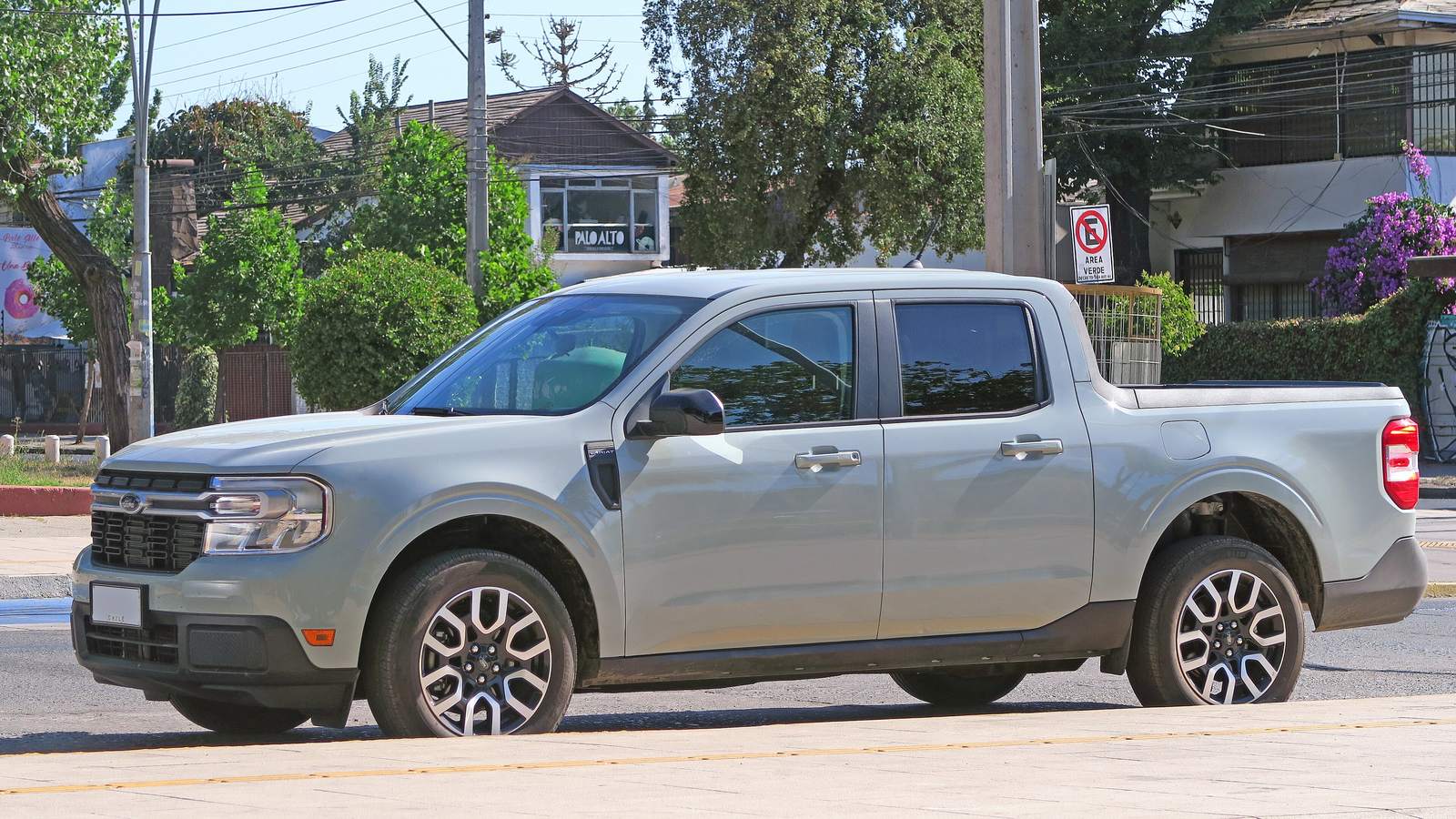 A grey Ford Maverick Hybrid Lariat pickup parked on a suburban street