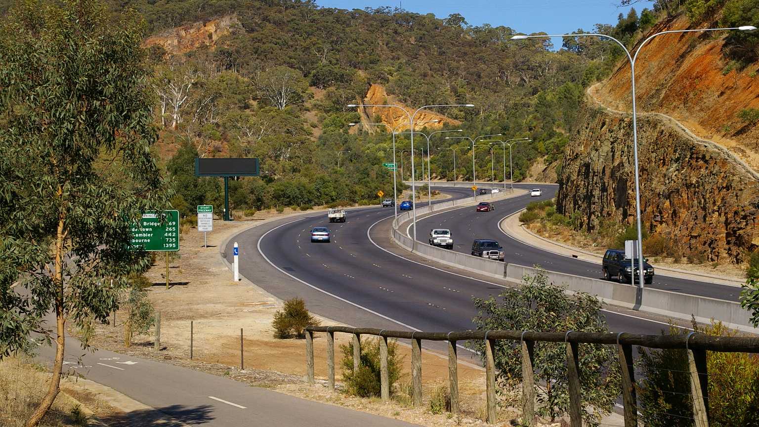 The South Eastern Freeway curving up into the Adelaide Hills at Glen Osmond, with a bike path in the foreground