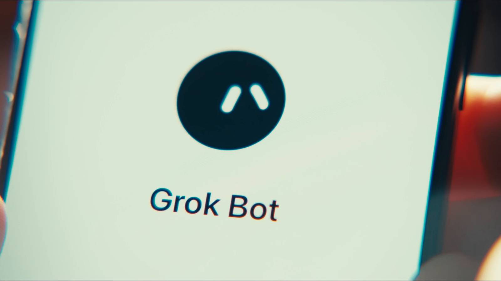 The Grok Bot app logo on a phone screen, in a still from SpaceXSI's official Grok Bot launch trailer