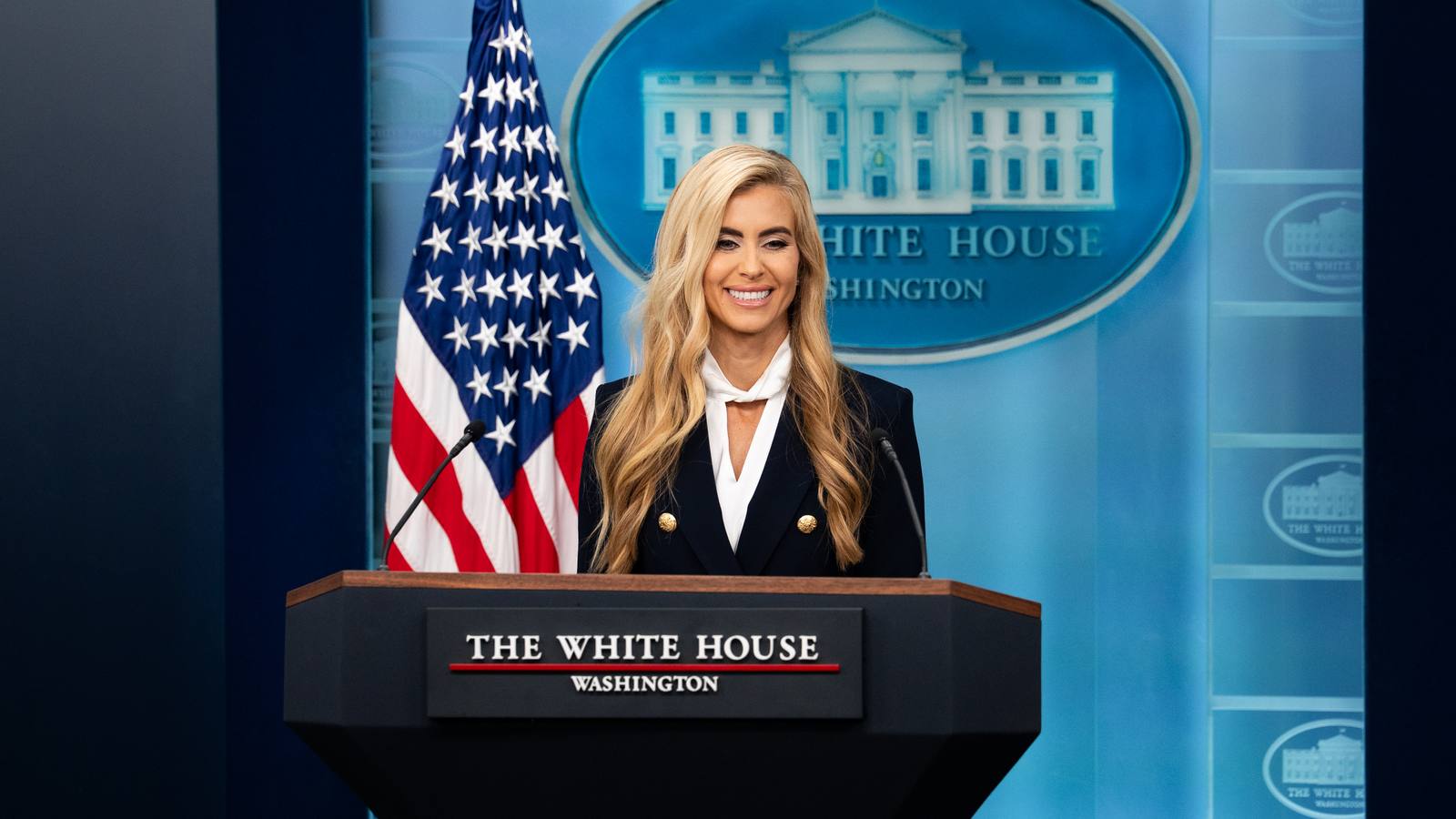 Katie Zacharia at the podium during her first White House press briefing on 13 October 2026