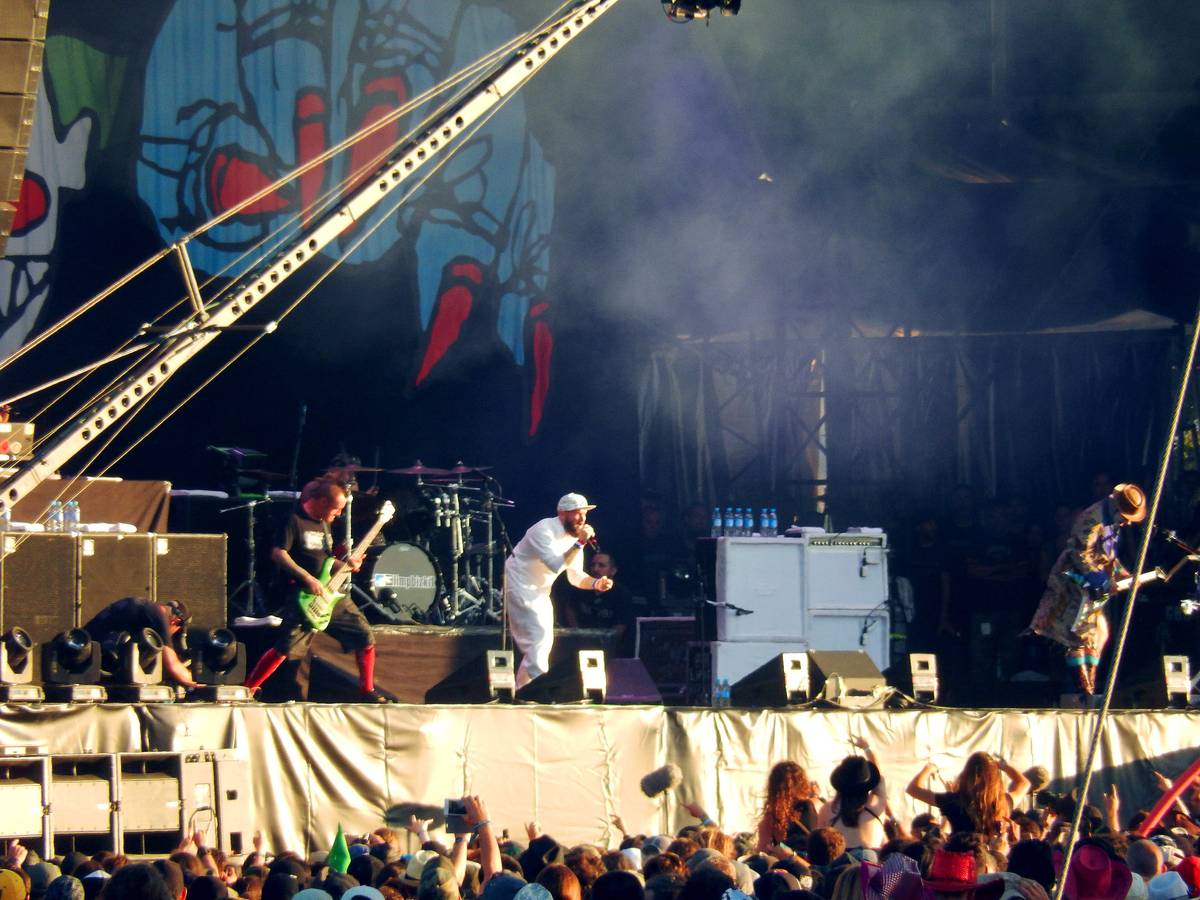 Limp Bizkit playing a festival main stage in front of a large crowd