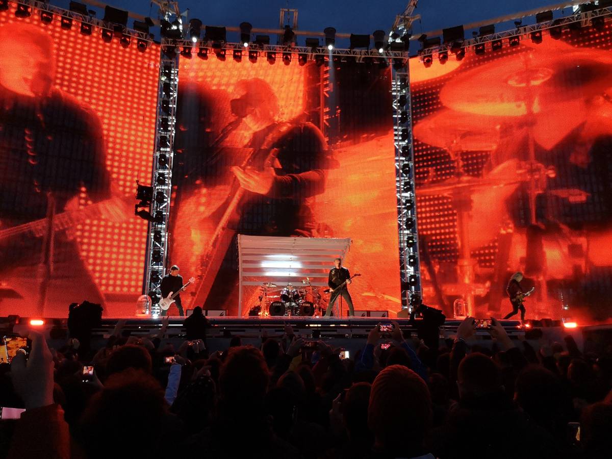 Metallica on a huge outdoor stage with screens in Milan