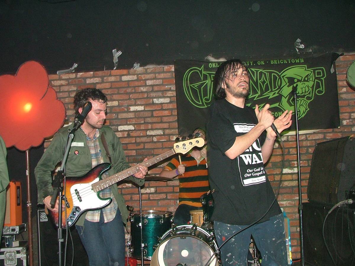 mewithoutYou playing in a small brick walled club