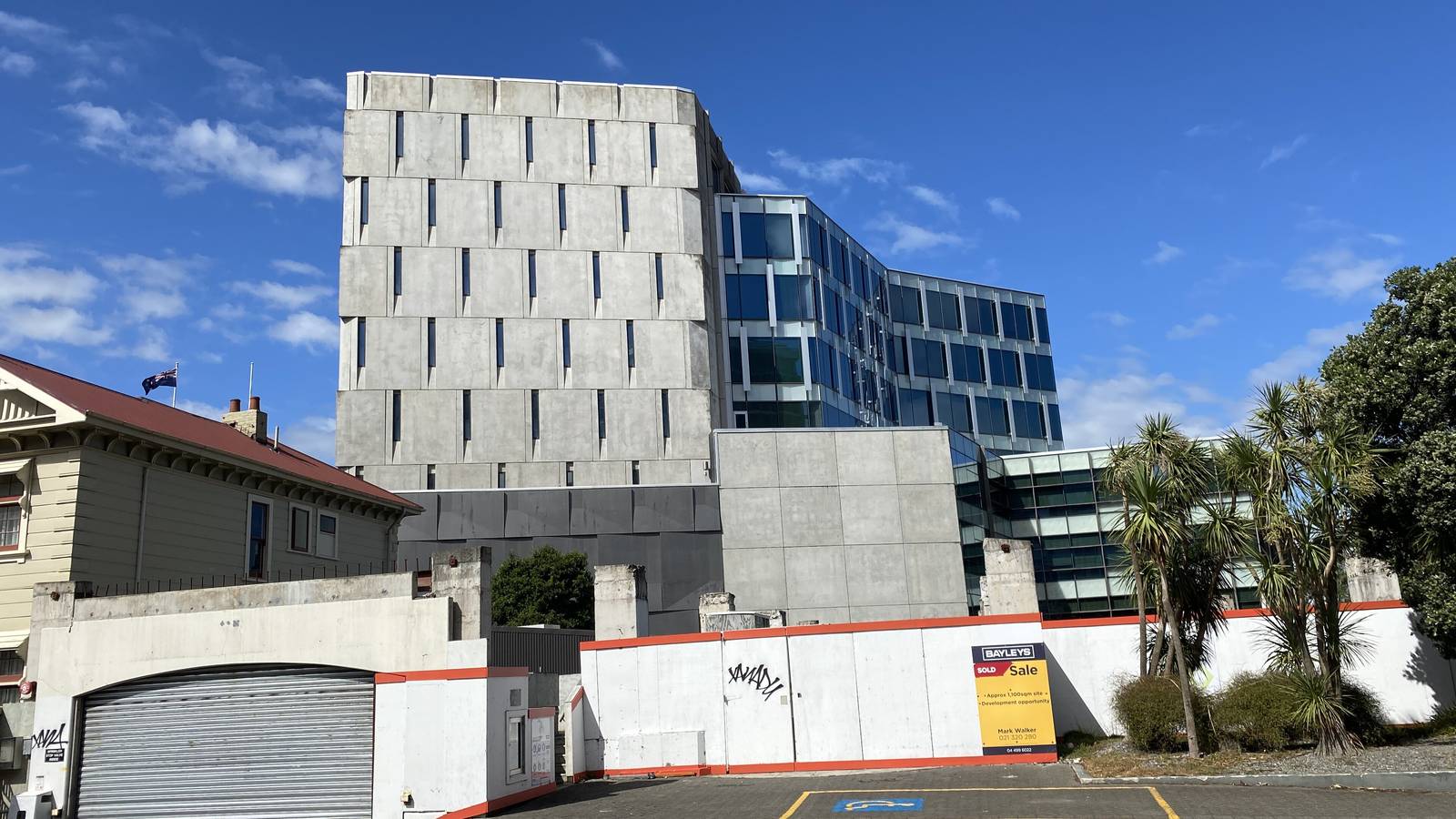 The Government Communications Security Bureau building, a pale stone block beside a glass office tower