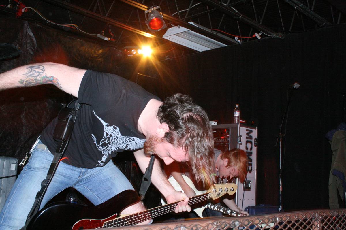 Oh, Sleeper members leaning over their instruments at the front of a club stage