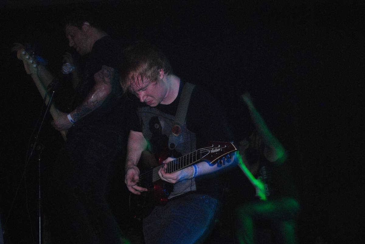 Oh, Sleeper guitarist playing on a dark stage