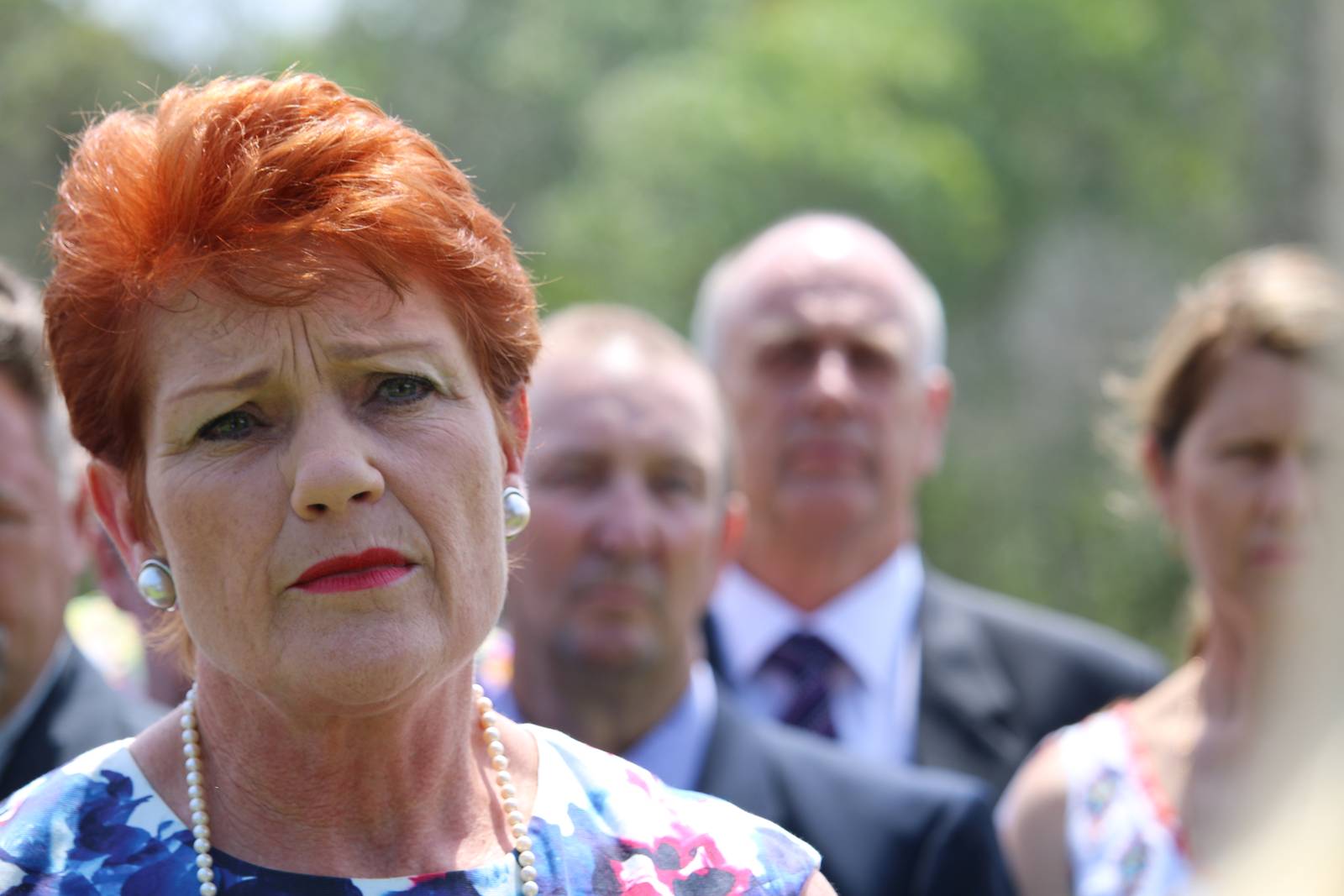 One Nation leader Pauline Hanson speaking outdoors at a microphone