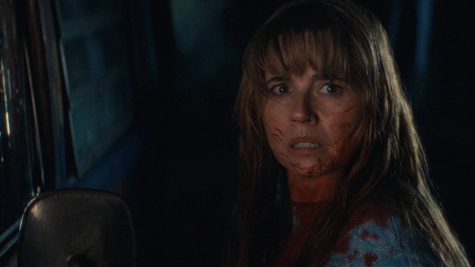 Crystal Lake still — campfire light, night woods — Peacock and A24
