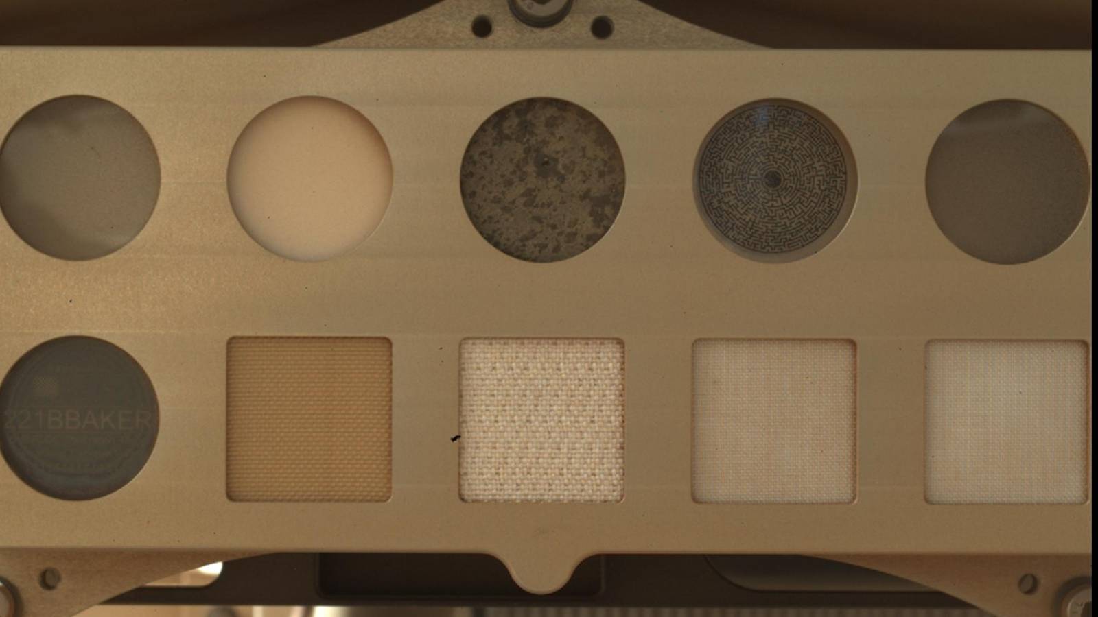 Spacesuit fabric swatches on the calibration target carried by NASA's Perseverance rover on Mars