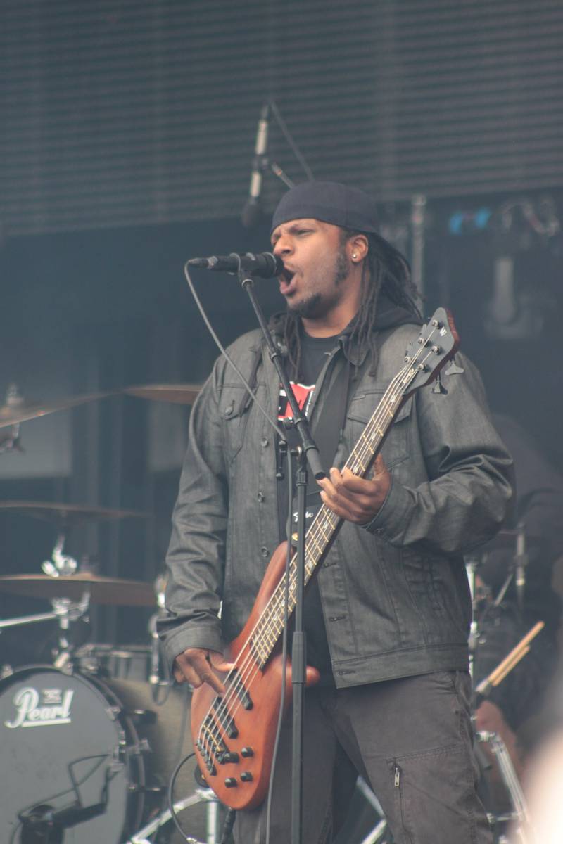 P.O.D. bassist Traa Daniels playing on a festival stage