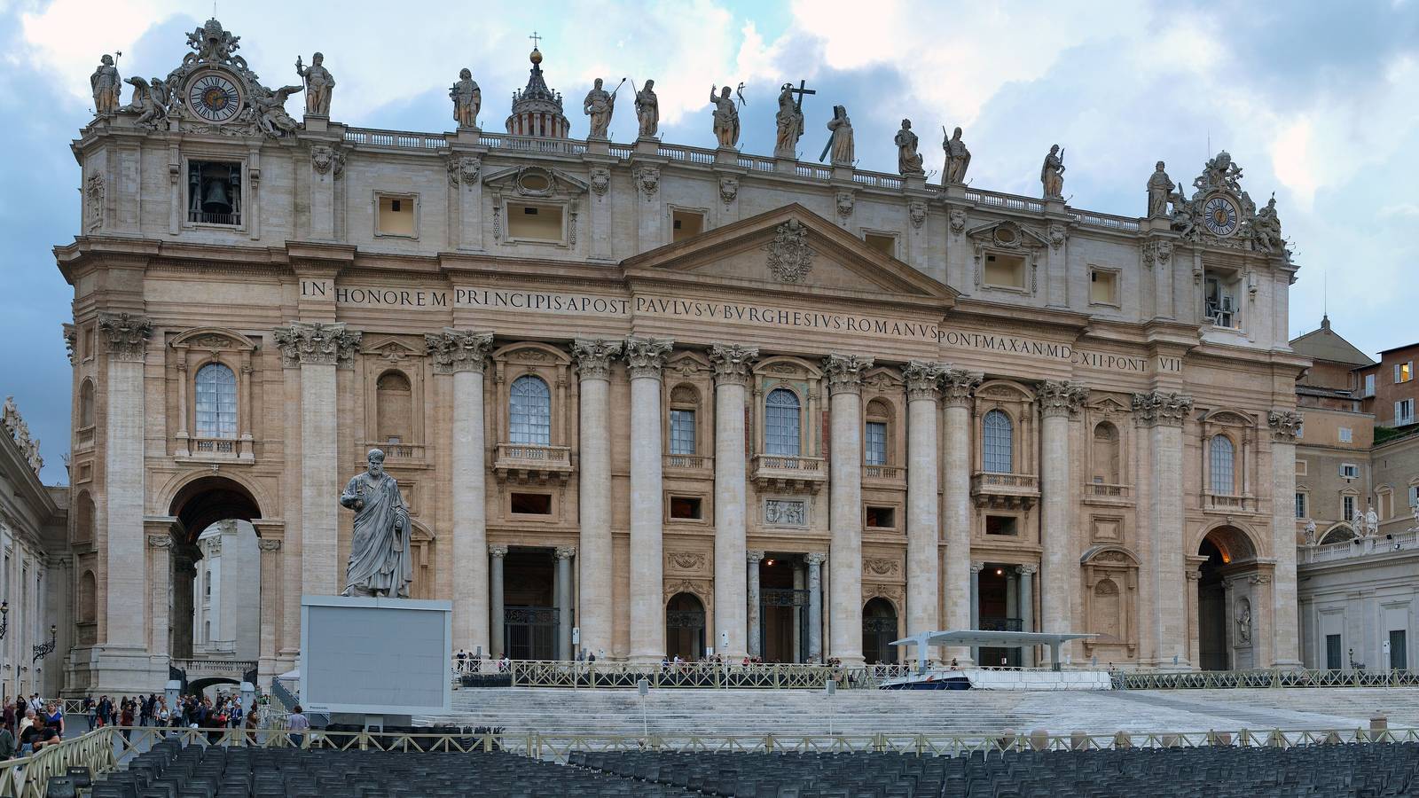 The facade of St Peter's Basilica above rows of chairs set out in St Peter's Square