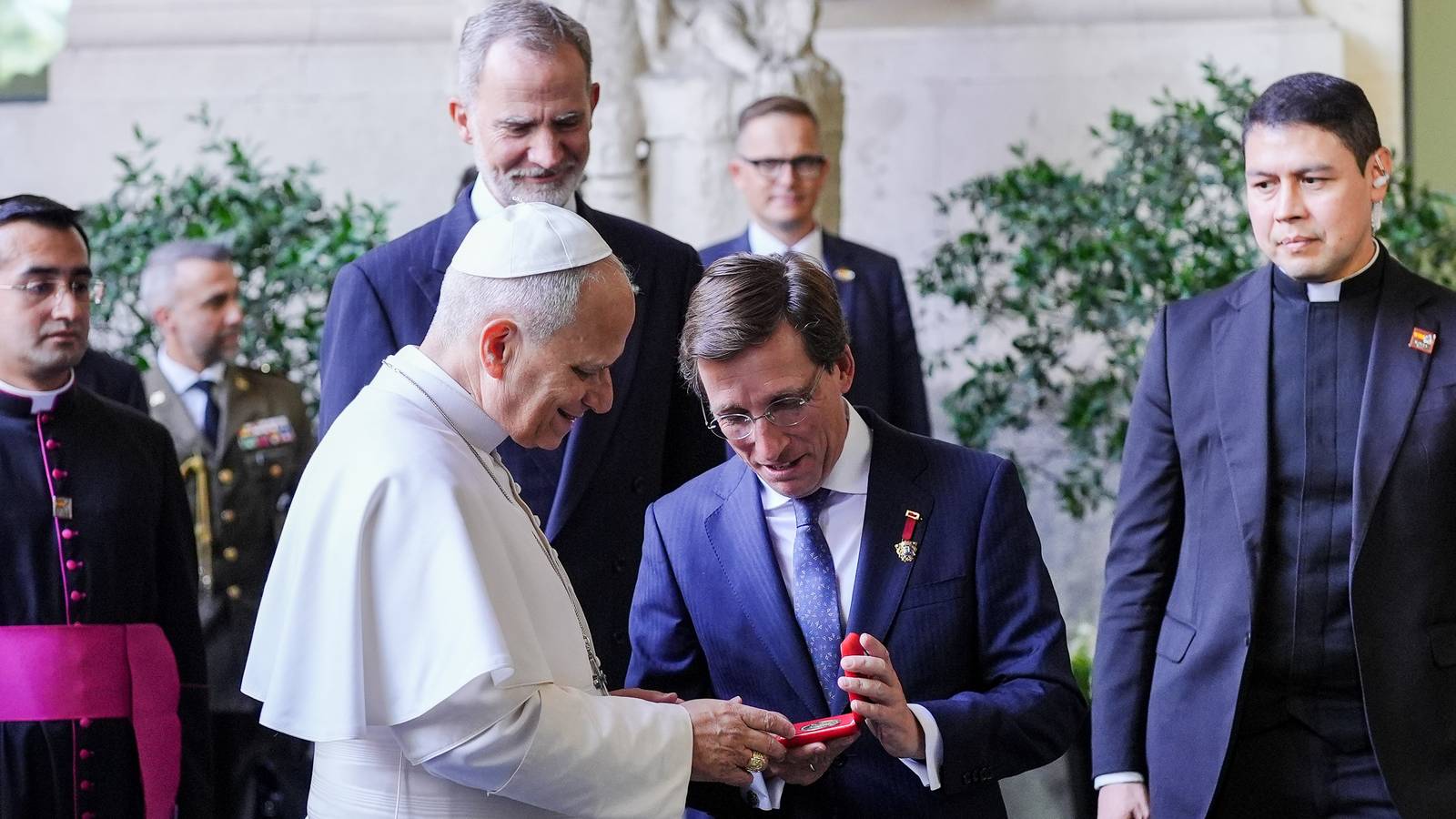 Pope Leo XIV in white cassock and zucchetto receives the Golden Key of Madrid from mayor Jose Luis Martinez Almeida