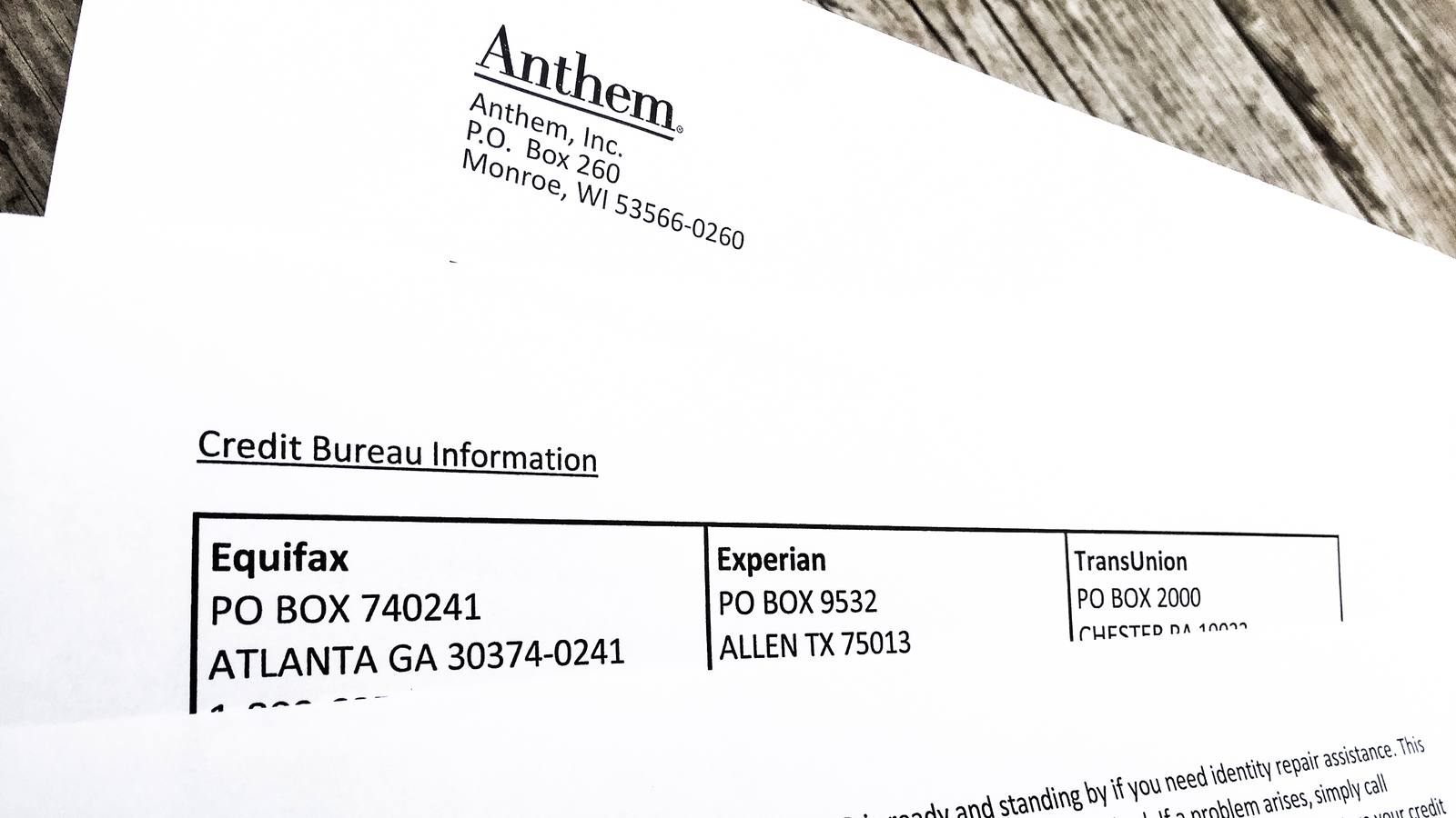 A printed breach notice letter listing contact details for the Equifax, Experian and TransUnion credit bureaus