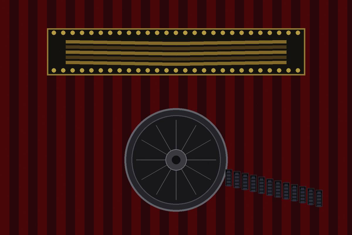 A 70mm film reel in front of a lit theater marquee with no lettering