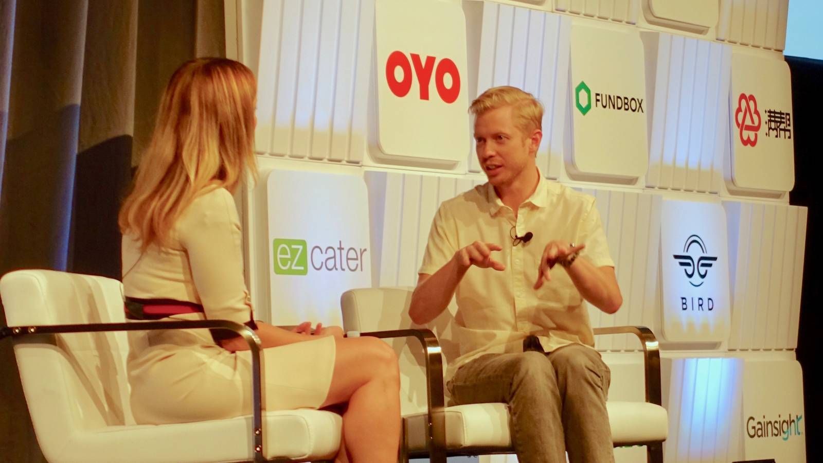 Reddit chief executive Steve Huffman seated on stage in a light shirt, talking at a Goldman Sachs conference