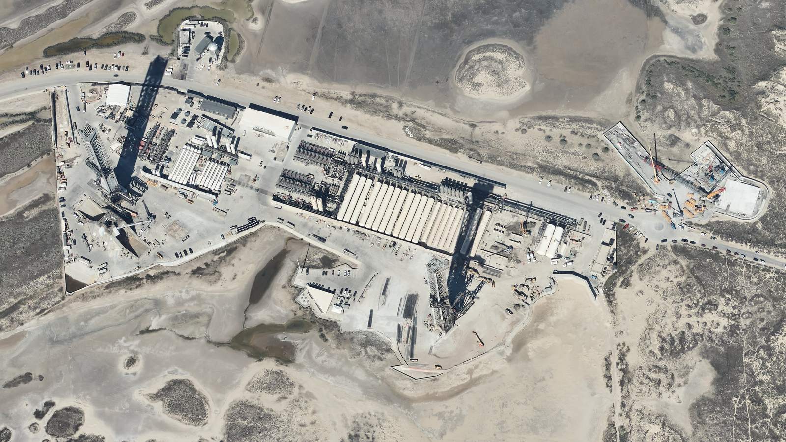 Aerial view of SpaceX's Starbase launch site in Texas with both launch towers and pads