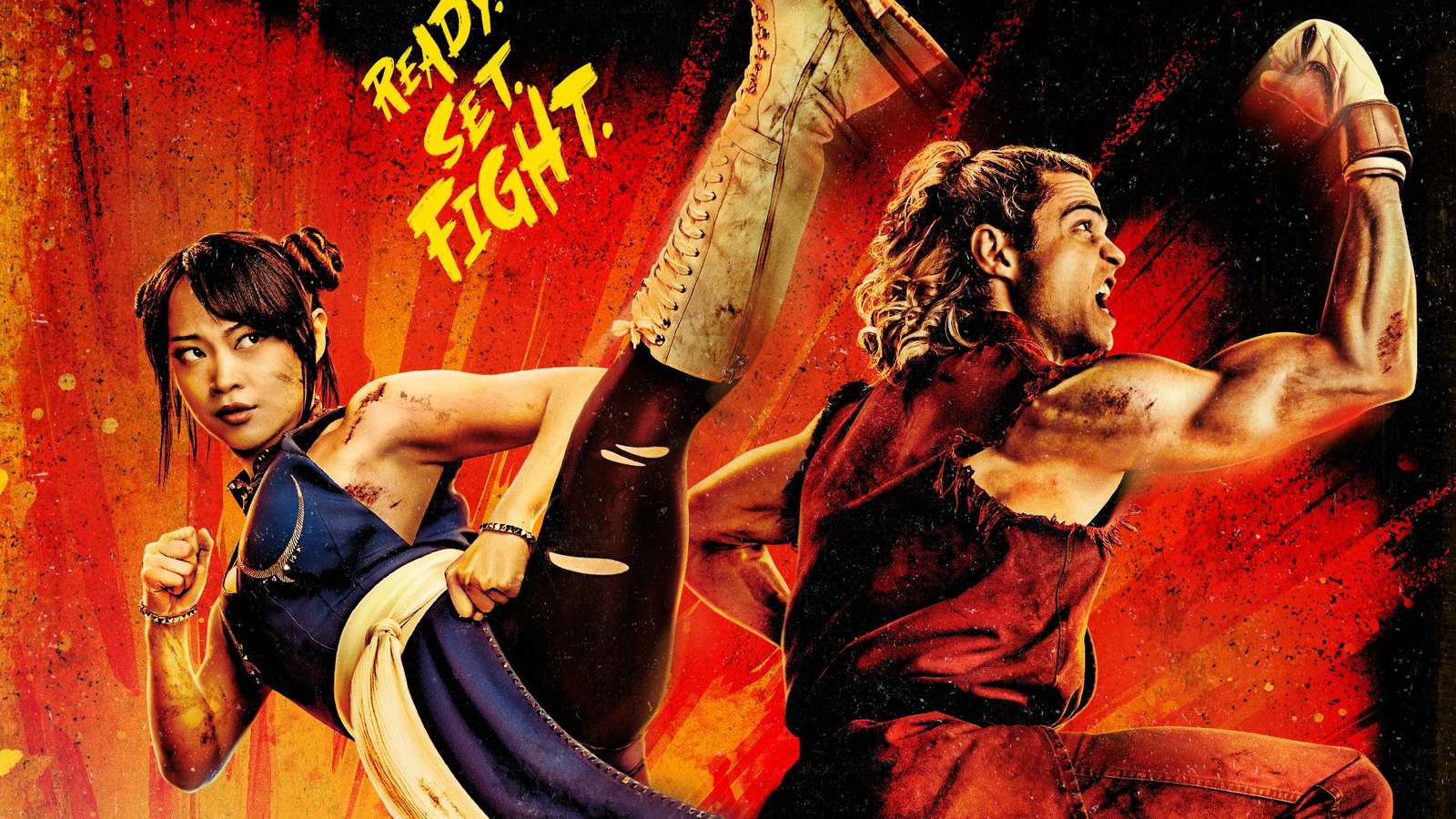 Chun Li mid kick beside Noah Centineo as Ken raising a fist against a fiery red background in Street Fighter key art