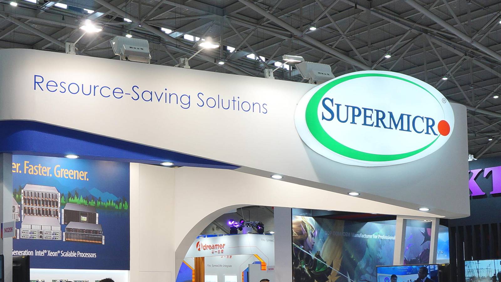 The Supermicro logo and Resource Saving Solutions banner on the company's trade show booth in Taipei