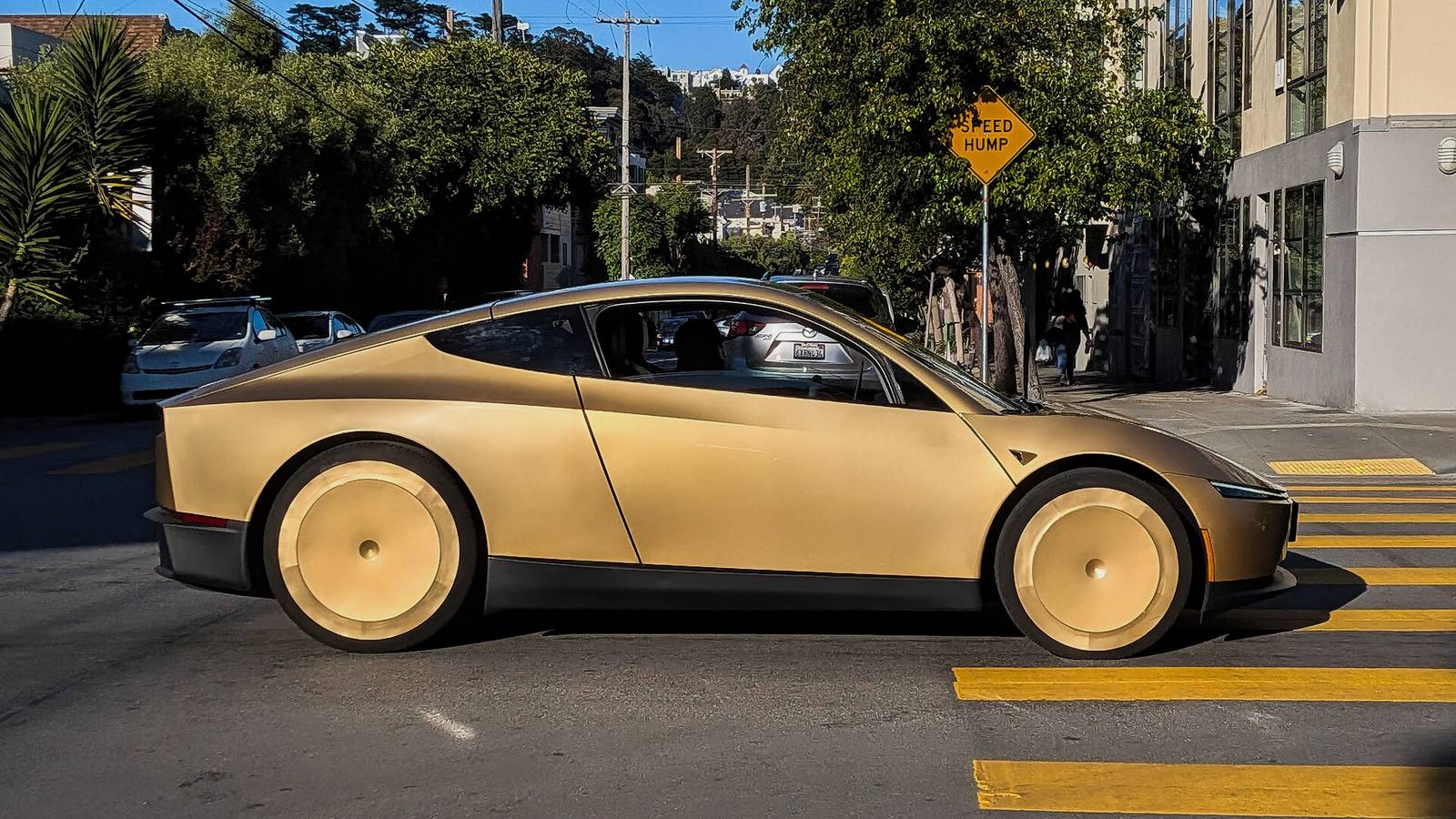 A Tesla Cybercab drives down Harrison Street in San Francisco in June 2026