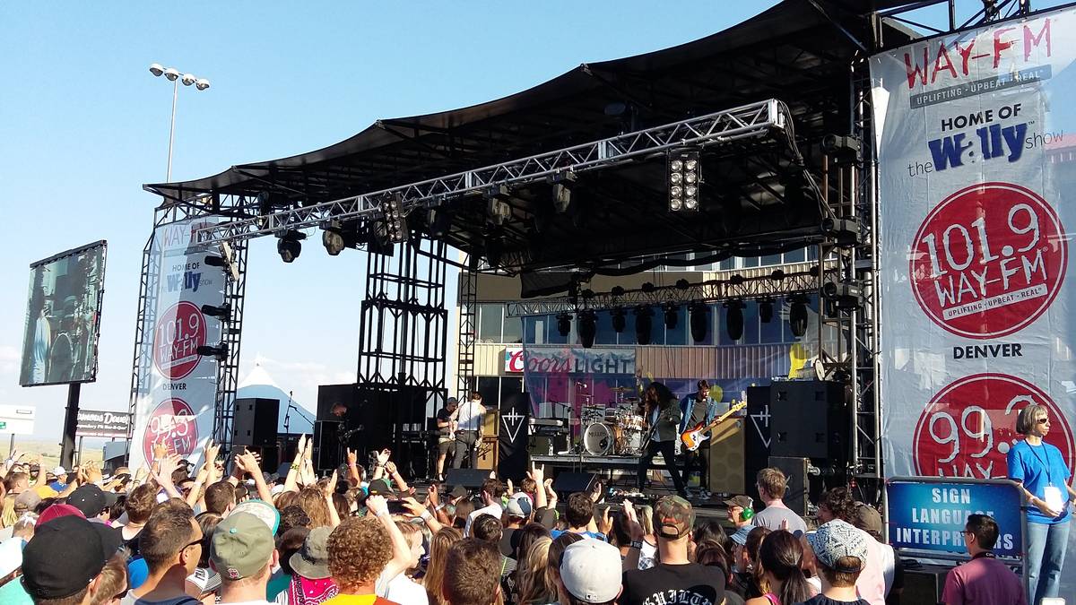 The Devil Wears Prada on a big outdoor stage in front of a festival crowd