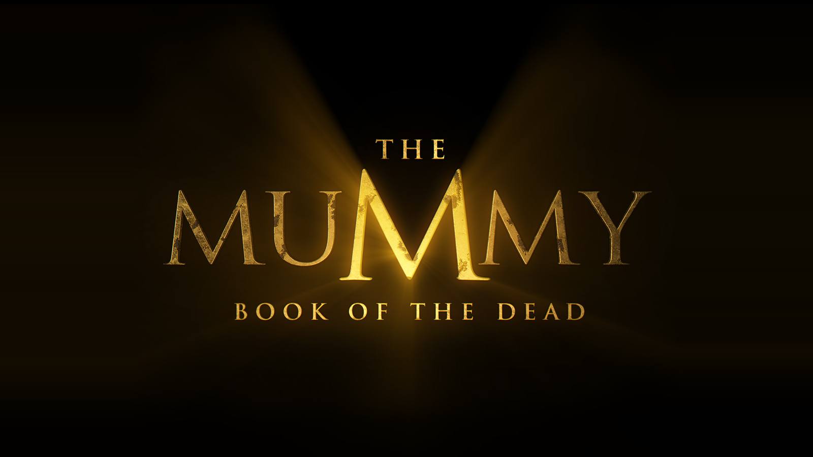 Gold title lettering for The Mummy Book of the Dead glowing on a black background