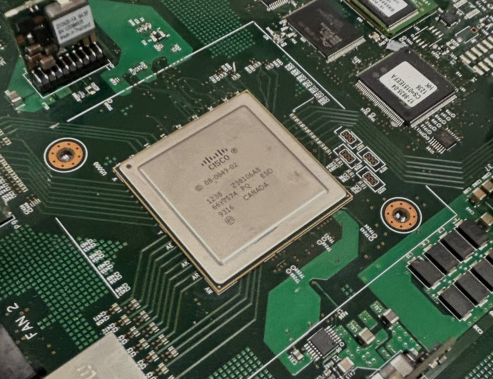 Darkened network traffic processing ASIC on a circuit board, object only