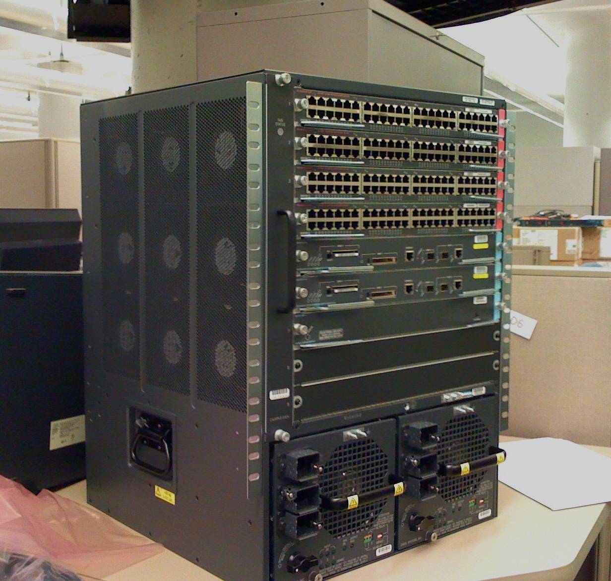 Darkened Cisco chassis network switch, object only