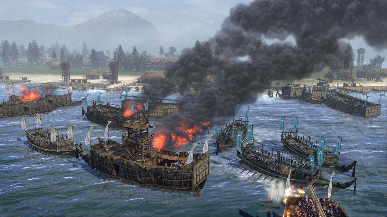 A naval battle from Total War Shogun 2 with wooden warships burning and black smoke rising over a Japanese harbour