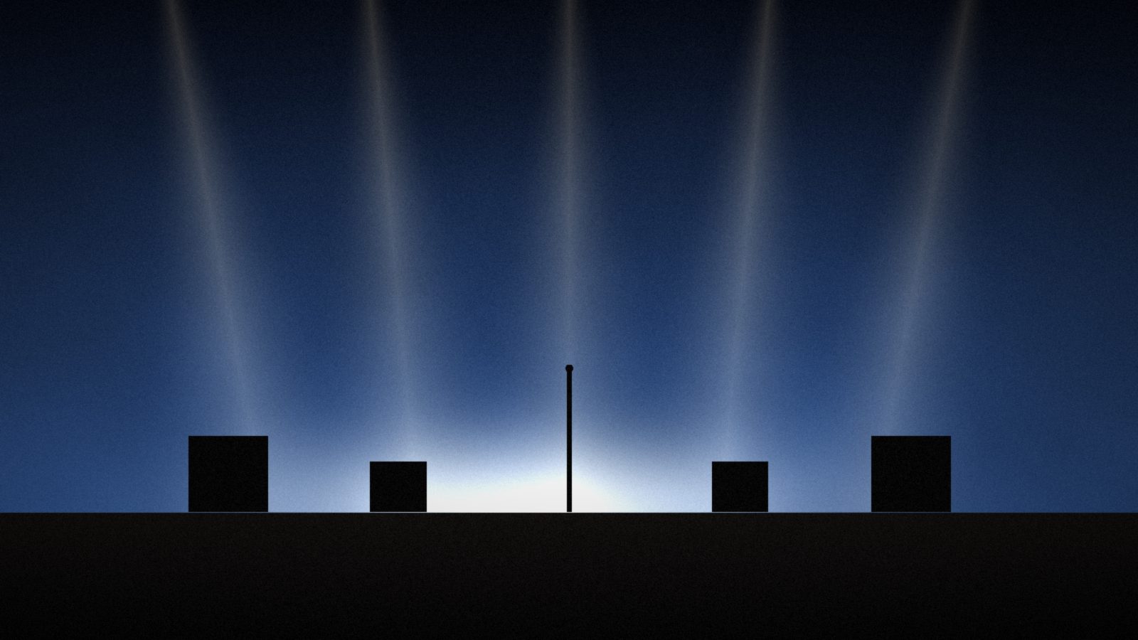 Stage beams fall through haze onto a dark stage with a single microphone stand between amps.