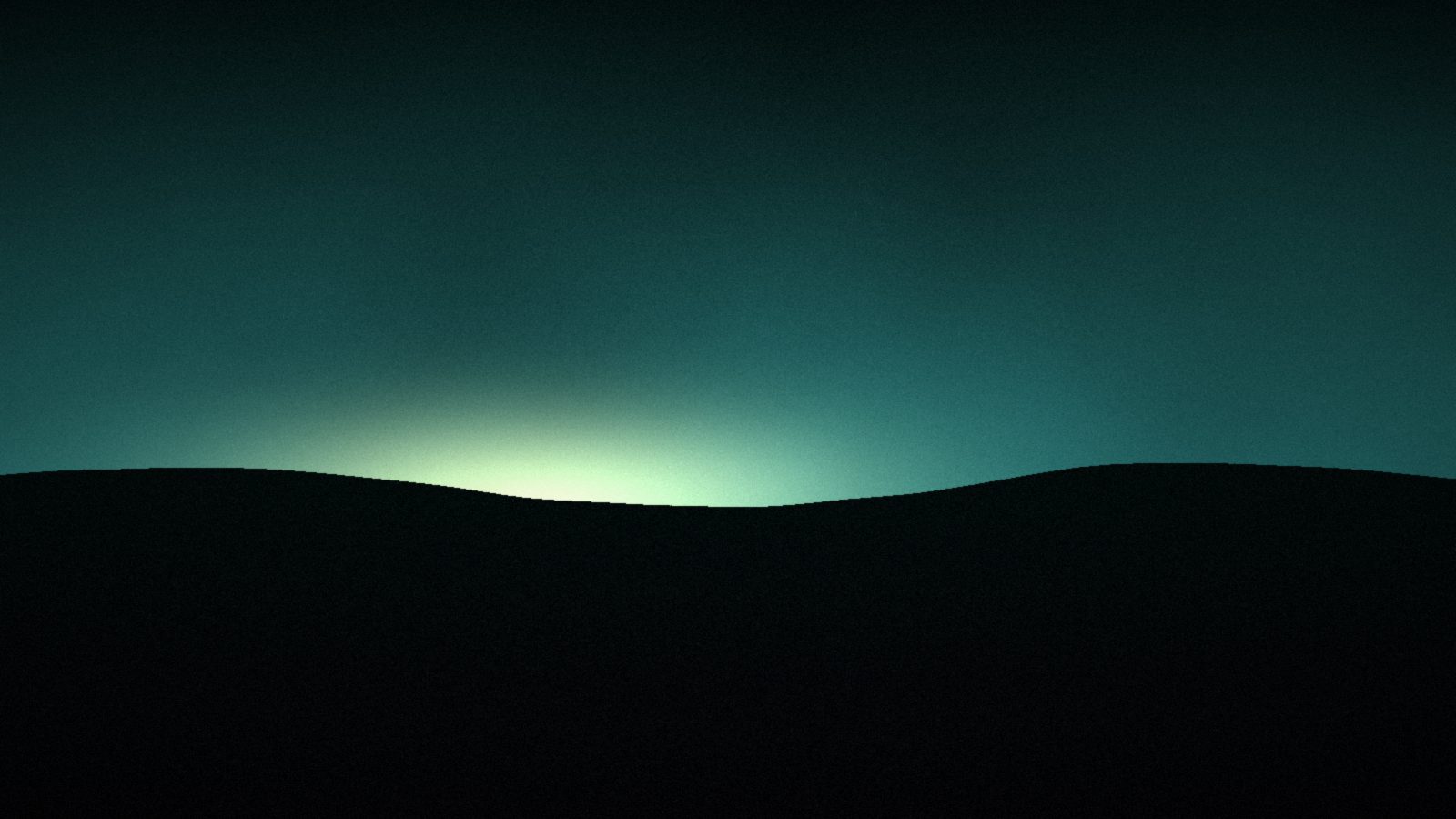 A dark field under a low amber sky at dusk, the last light sitting on the horizon.