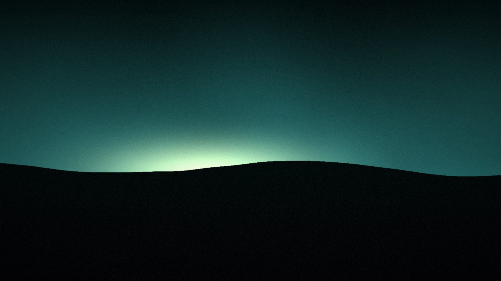 A dark field under a low glowing sky at dusk, the last light on the horizon.