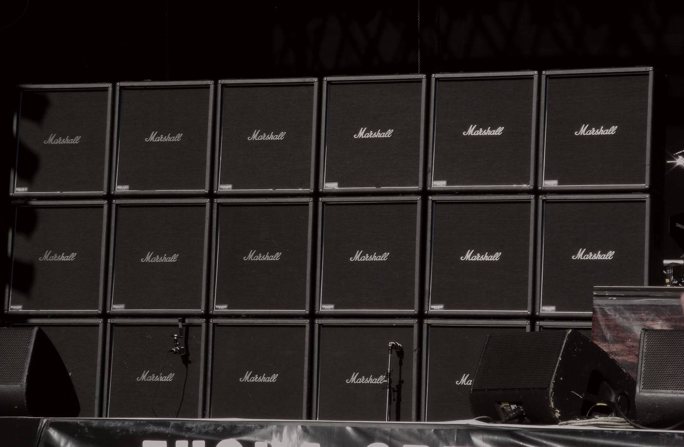 Amp stack under stage wash — early-2000s hard-rock still