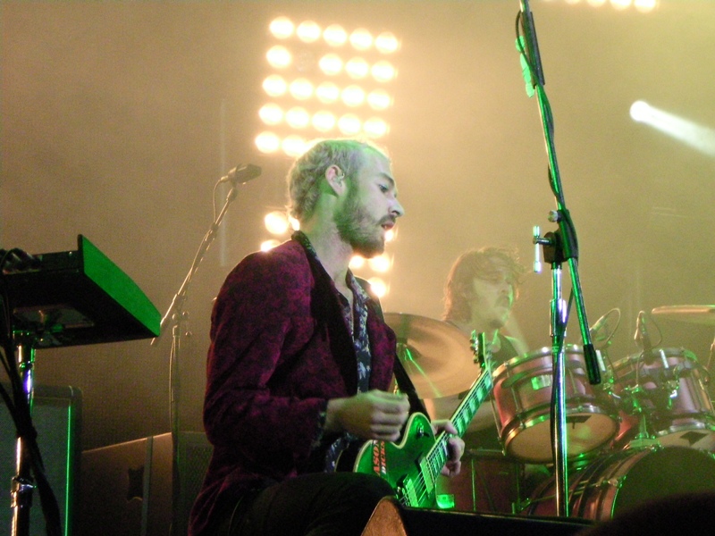 Silverchair performing on a festival stage under green light in 2010