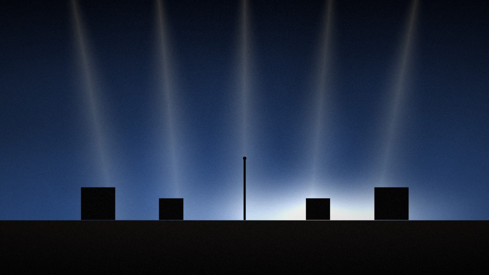 Stage beams fall through haze onto a dark stage with a single microphone stand between amps.